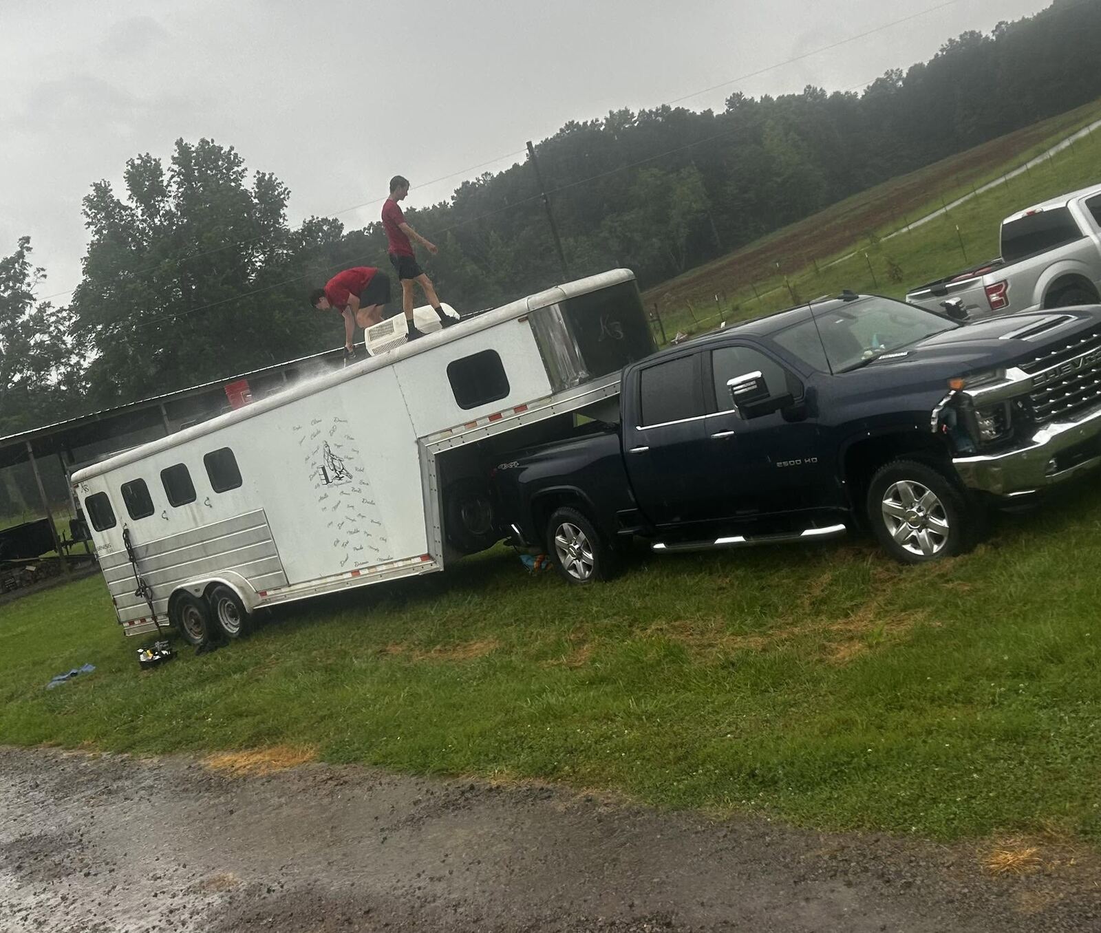 Platinum Touch team pressure washing a horse trailer on-site in Northwest Georgia
